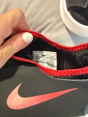 Nike Black Slip-On Sneaker with Red Swoosh